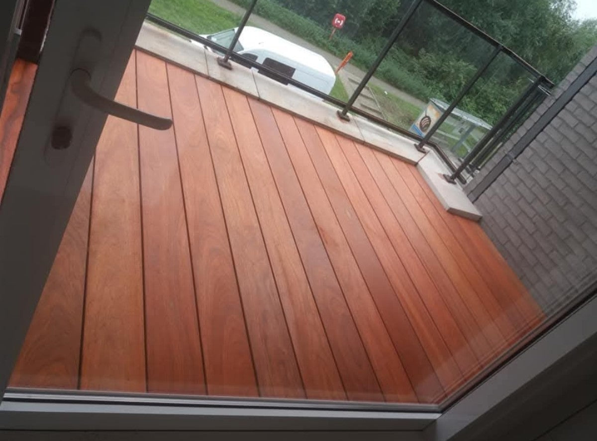 Houten terras in padouk, voor en na